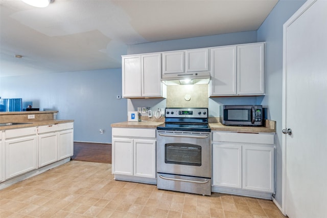 kitchen featuring white cabinets and appliances with stainless steel finishes