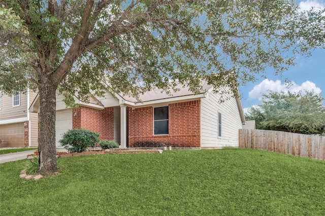 single story home with a front yard and a garage