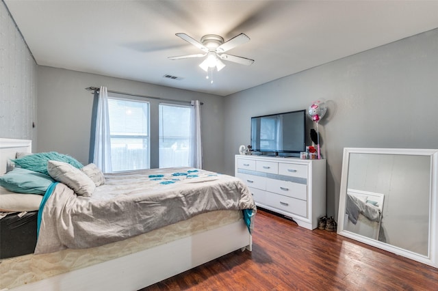 bedroom with ceiling fan and dark hardwood / wood-style floors