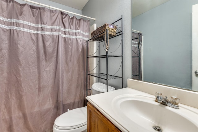 full bathroom with vanity, toilet, and shower / tub combo with curtain