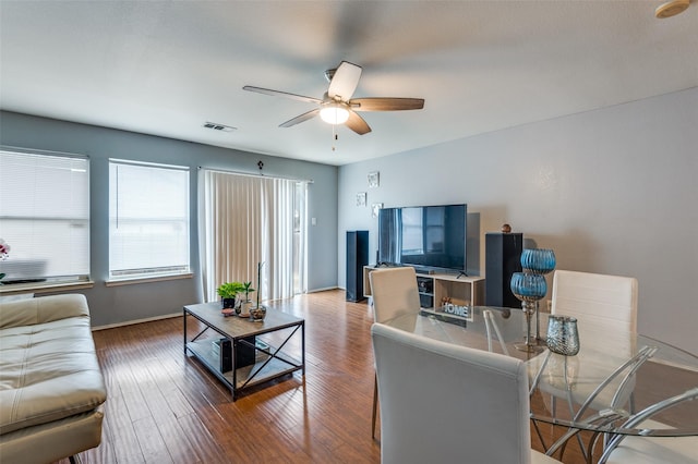 living room with ceiling fan and wood-type flooring