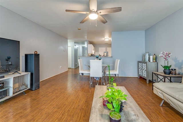 living room featuring hardwood / wood-style flooring and ceiling fan