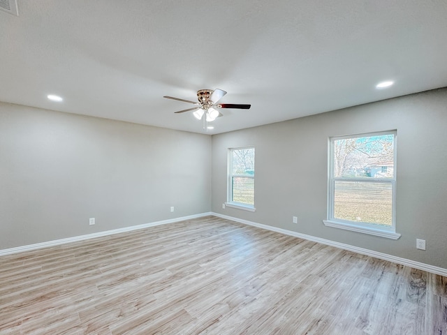 unfurnished room featuring light hardwood / wood-style flooring and ceiling fan