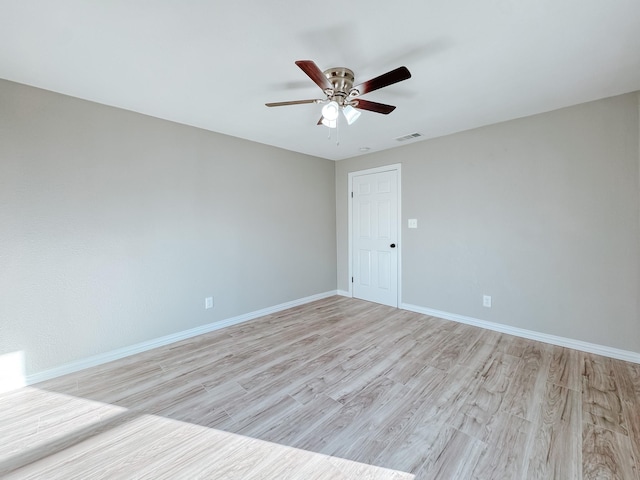 unfurnished room with ceiling fan and light hardwood / wood-style flooring