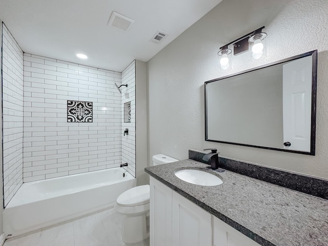 full bathroom featuring tiled shower / bath combo, vanity, and toilet