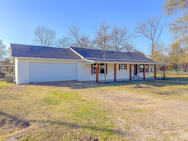 single story home featuring a garage, central AC, a front yard, and covered porch