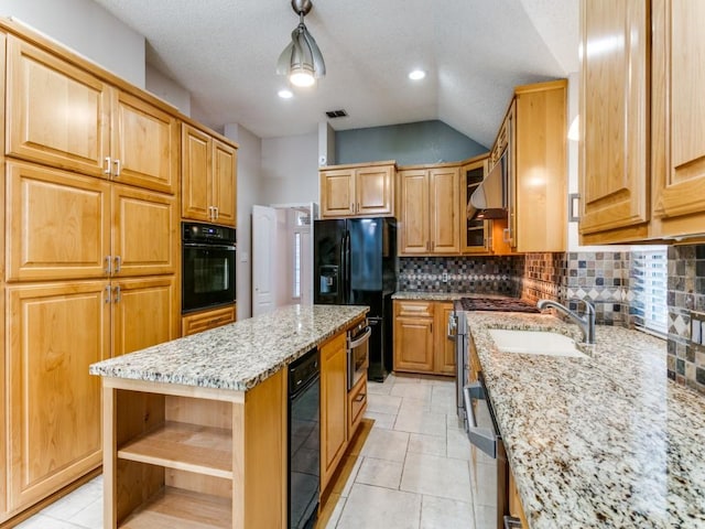 kitchen featuring a kitchen island, pendant lighting, range hood, light stone counters, and black appliances