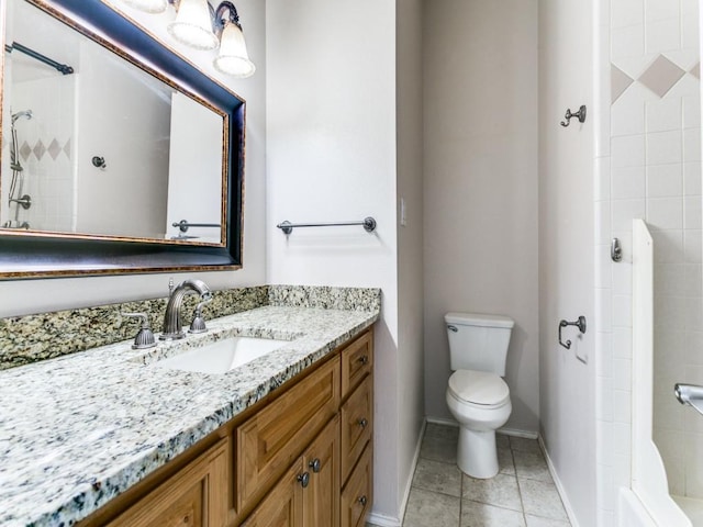 bathroom featuring tiled shower, tile patterned floors, vanity, and toilet