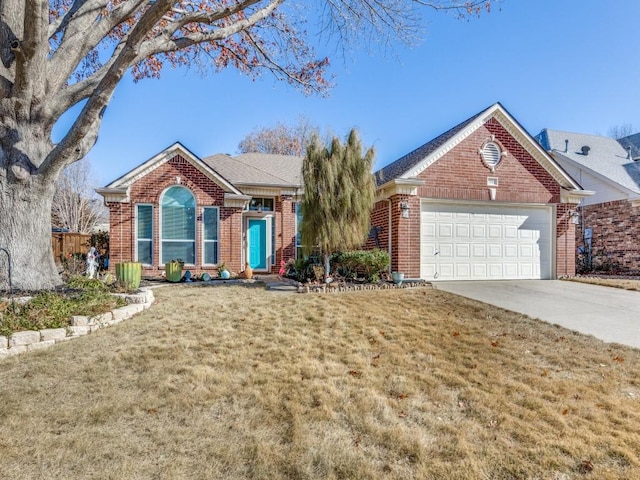 view of front of house featuring a garage and a front yard