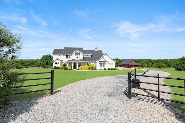 new england style home with a front yard