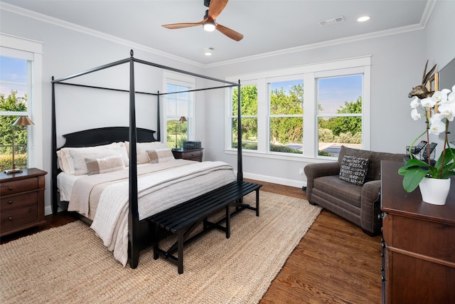 bedroom featuring wood-type flooring, ceiling fan, and ornamental molding