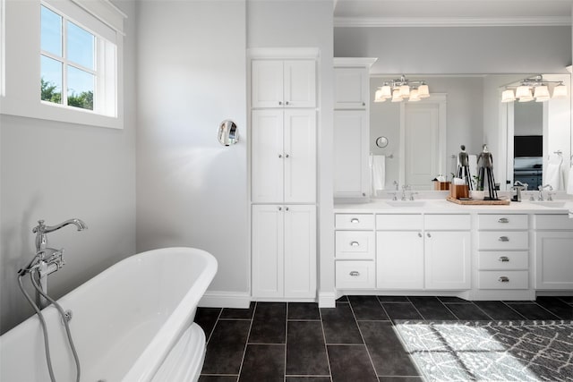 bathroom with a tub, tile patterned floors, and vanity