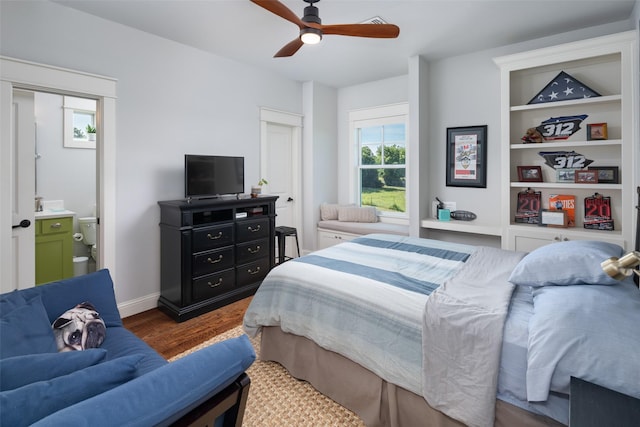 bedroom featuring hardwood / wood-style floors, ensuite bath, and ceiling fan