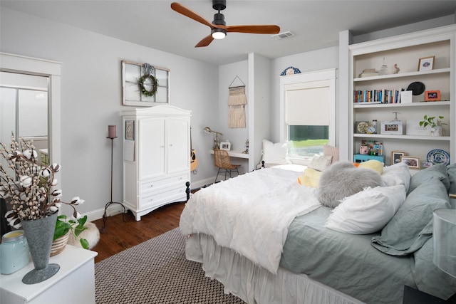 bedroom with ceiling fan and dark wood-type flooring