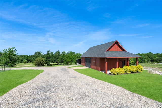 view of side of home with a lawn