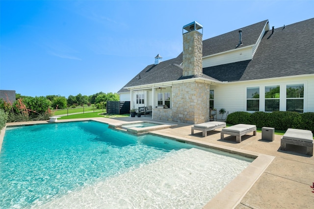 view of pool with an in ground hot tub and a patio area