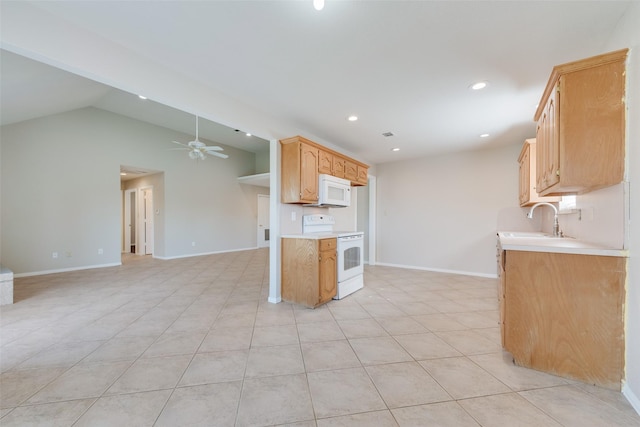 kitchen with white appliances, lofted ceiling, sink, ceiling fan, and light tile patterned flooring