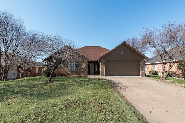 single story home featuring a garage and a front lawn