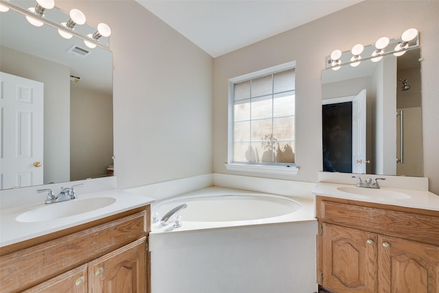 bathroom featuring vanity, lofted ceiling, and separate shower and tub