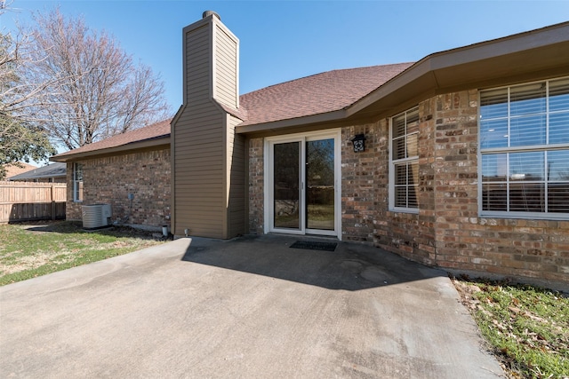 back of house with a patio and central AC unit