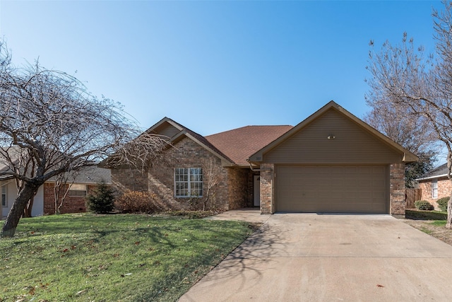 view of front of home with a front yard and a garage