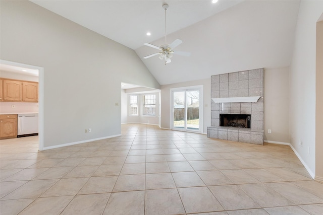 unfurnished living room featuring high vaulted ceiling, ceiling fan, light tile patterned floors, and a tiled fireplace