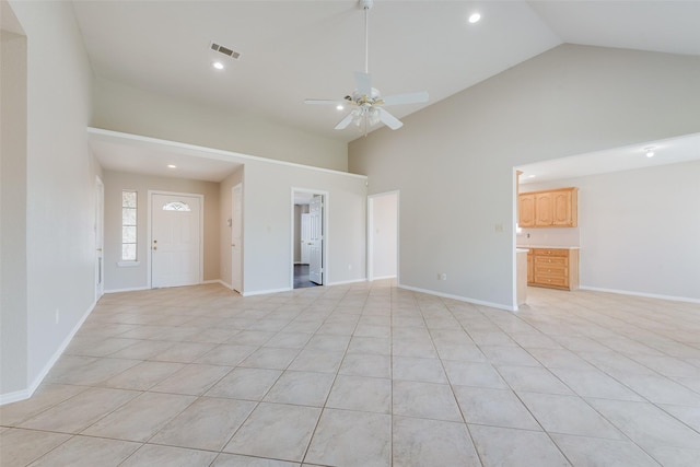 unfurnished living room featuring ceiling fan, high vaulted ceiling, and light tile patterned floors