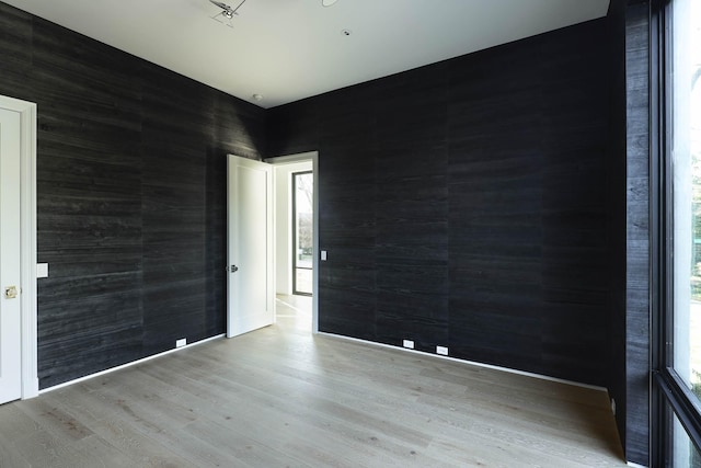 unfurnished room featuring light hardwood / wood-style floors