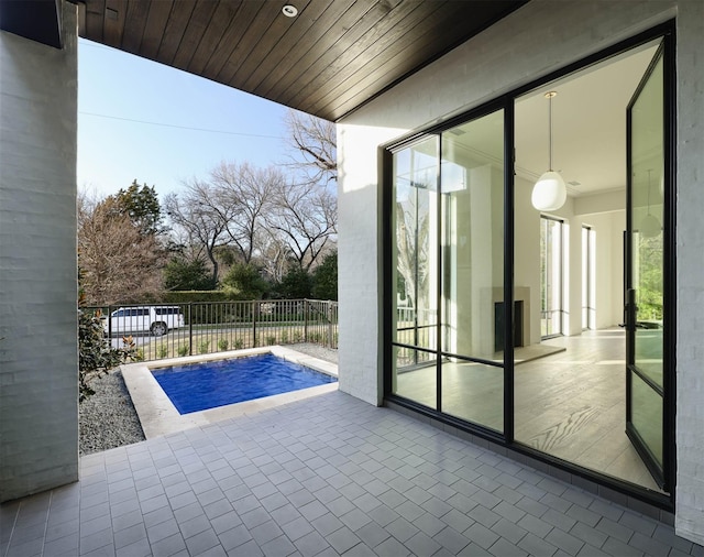 view of swimming pool with a patio area