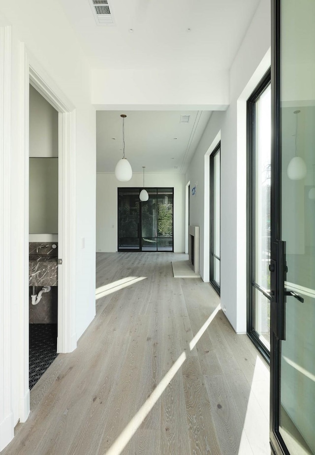 hallway featuring light wood-type flooring