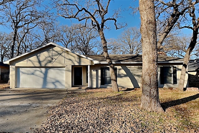 ranch-style home with a garage