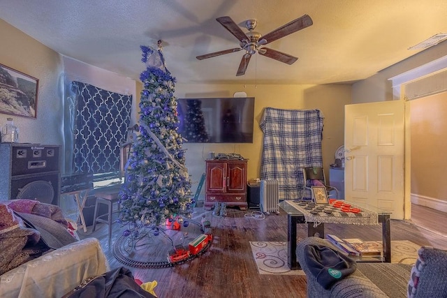 interior space featuring ceiling fan and hardwood / wood-style floors