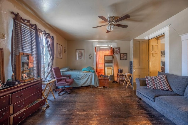 bedroom with ceiling fan and dark hardwood / wood-style flooring