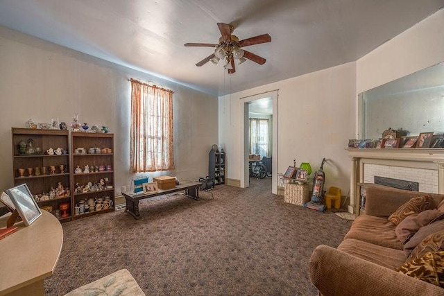 living room featuring ceiling fan, a brick fireplace, carpet flooring, and plenty of natural light