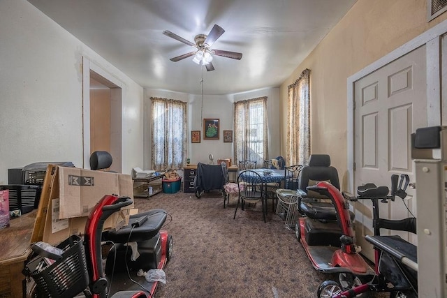 miscellaneous room featuring carpet flooring and ceiling fan