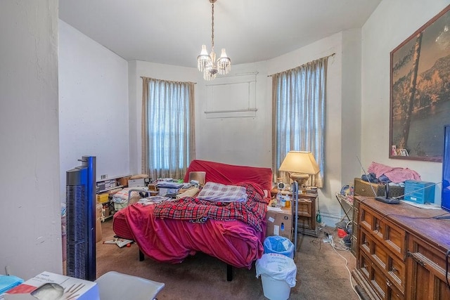 carpeted bedroom featuring multiple windows and a notable chandelier