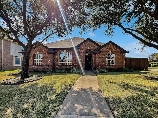 ranch-style house with a front yard