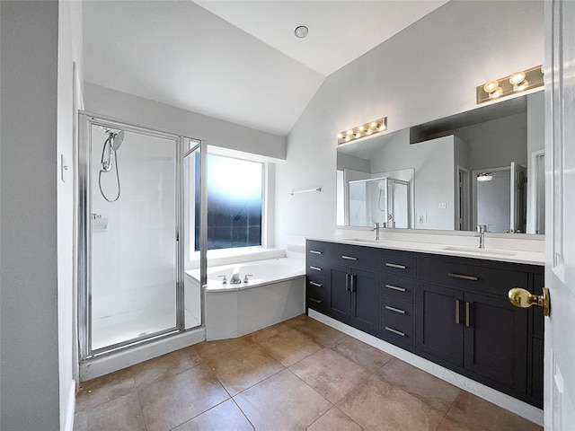 bathroom featuring tile patterned floors, shower with separate bathtub, vanity, and vaulted ceiling