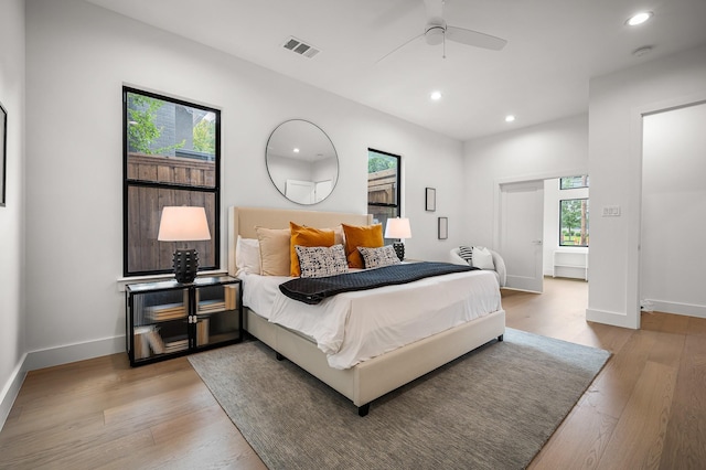 bedroom featuring light wood-type flooring and ceiling fan