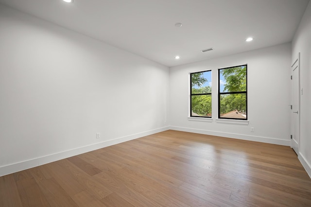 empty room with light hardwood / wood-style floors