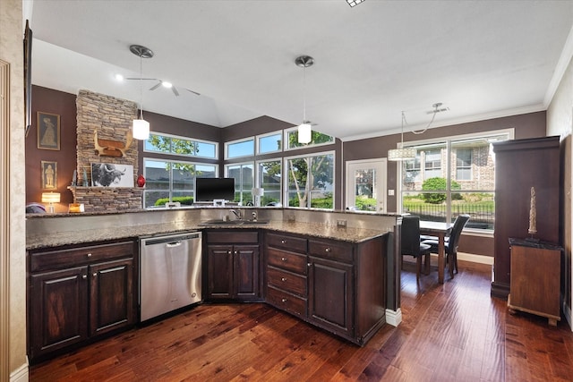 kitchen featuring dark stone counters, dishwasher, dark brown cabinetry, and hanging light fixtures