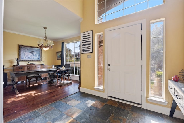 foyer entrance with an inviting chandelier