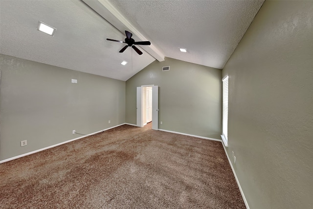 carpeted spare room featuring ceiling fan, a textured ceiling, and lofted ceiling with beams