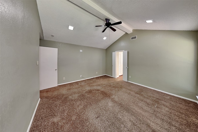 carpeted spare room featuring ceiling fan, a textured ceiling, and lofted ceiling with beams