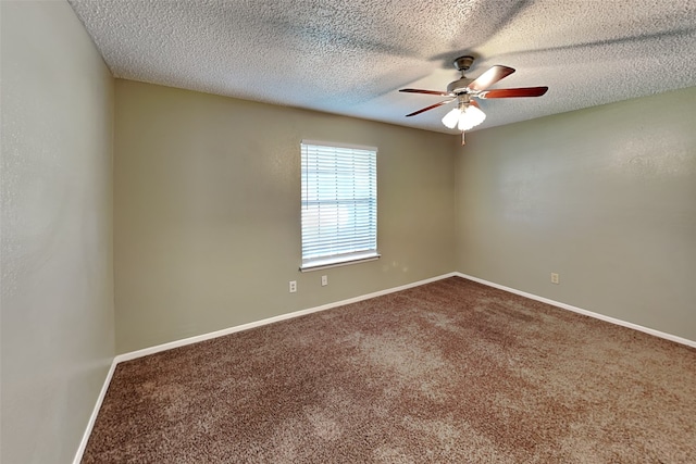 carpeted spare room with ceiling fan and a textured ceiling