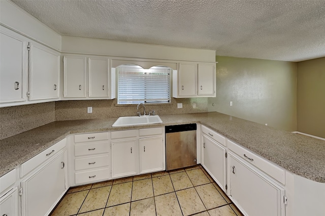 kitchen featuring sink, white cabinetry, a textured ceiling, and stainless steel dishwasher