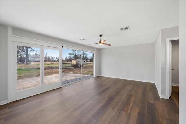 spare room with ceiling fan and dark hardwood / wood-style floors