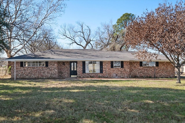 ranch-style home featuring a front yard