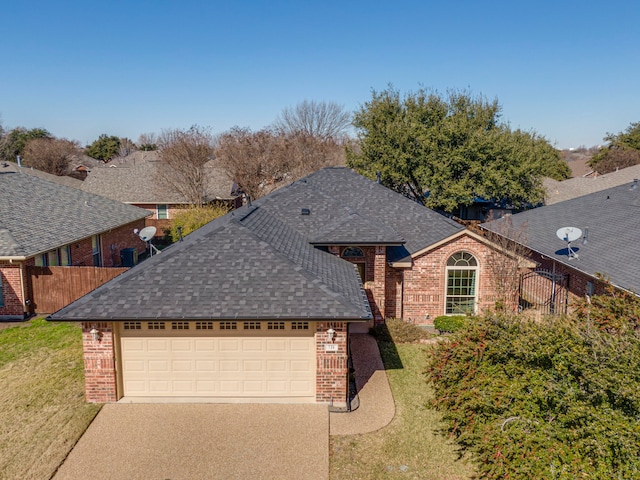 view of front of property with a garage and a front lawn