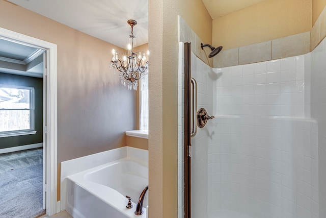 bathroom featuring plus walk in shower and a notable chandelier